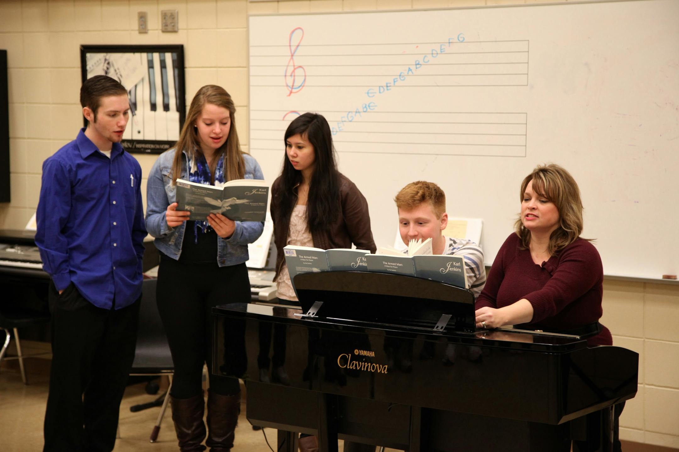 (Left to Right) Kyle Abraham, 17, of Lakeville; Abby Hillyer, 16, of Lakeville; Christina Meyer, 17, of Elko; Christian Meyer, 17, of Lakeville and Julie Brott, of Lakeville, rehearsed ìThe Armed Manî at Lakeville South High School. (Photo by Hamilton Johnston)