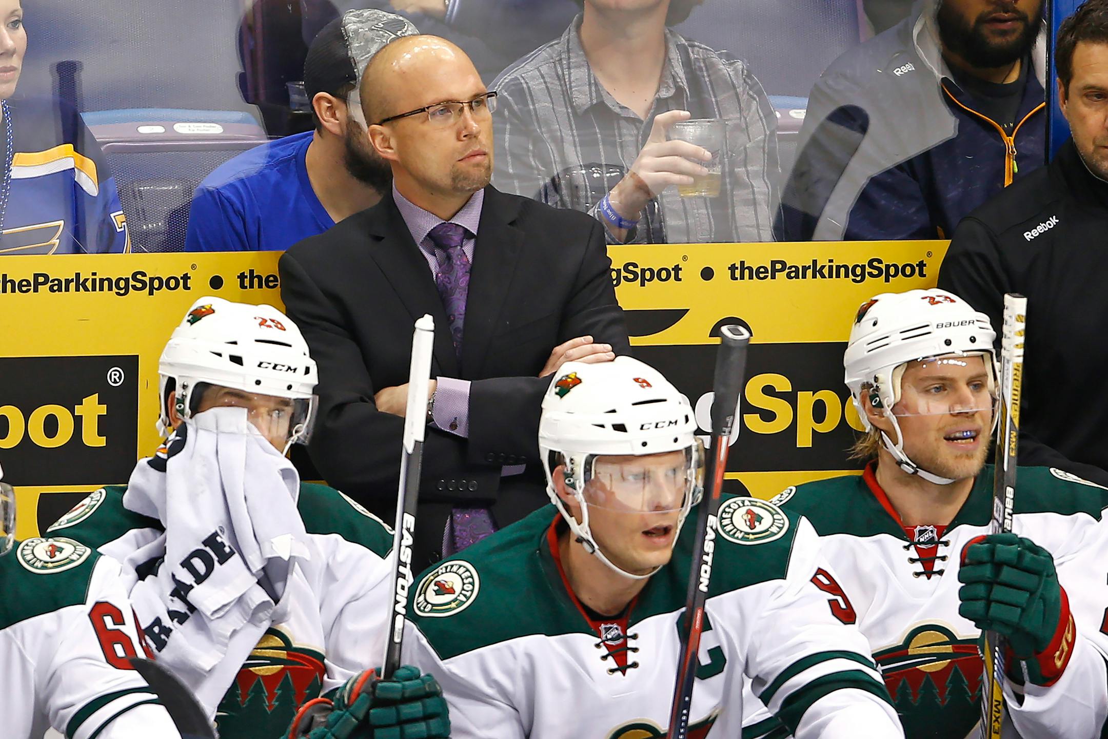 Wild head coach Mike Yeo watches his team from the bench during the first period against the St. Louis Blues in Game 1 of the Western Conference quarterfinals at Scottrade Center. (Cal Sport Media via AP Images)
