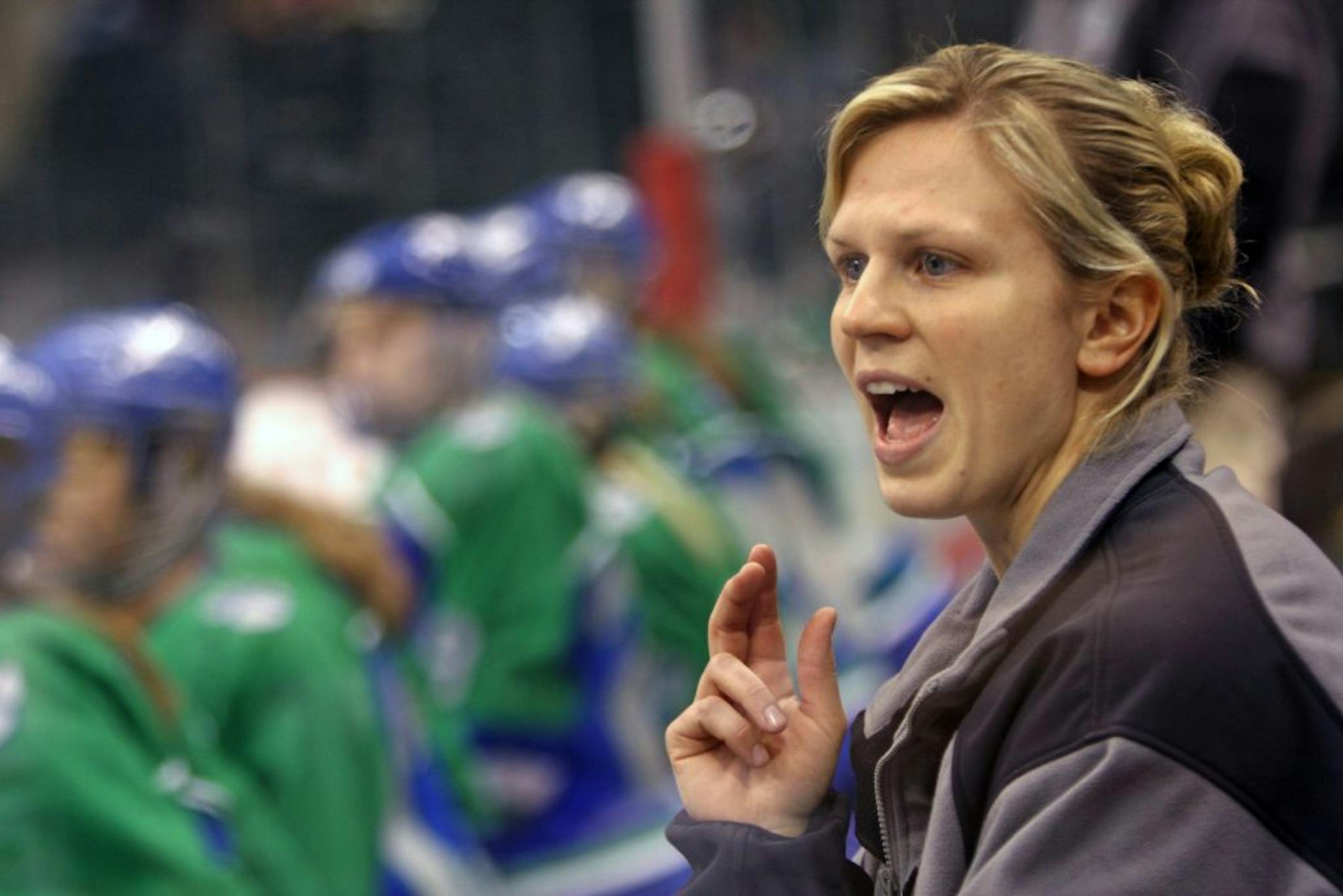 As an Eagan assistant coach in 2008, Natalie Darwitz yelled out instructions during a high school quarterfinal game against Farmington.