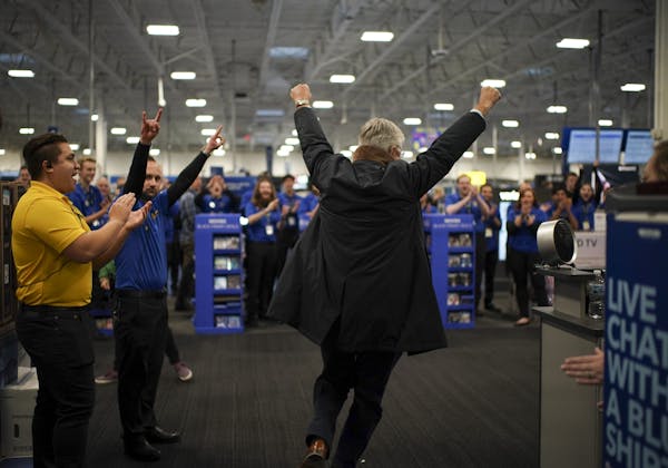 Best Buy Eden Prairie employees cheered as CEO Hubert Joly entered the store before opening late Thursday afternoon. Retailers are banking on a strong