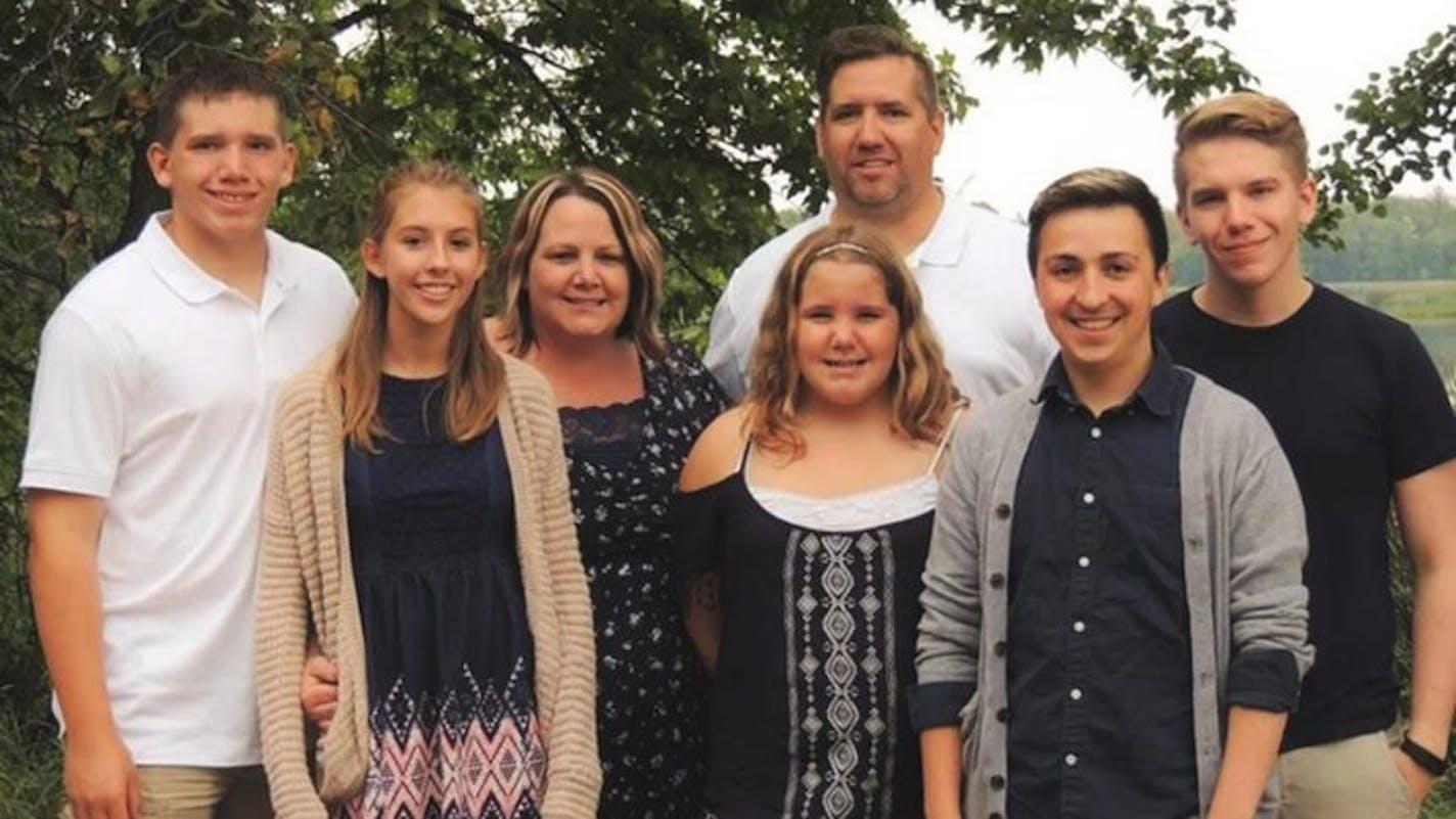 From left is Carter Peterson; his girlfriend, Sarah Hanna; mother, Chasity Peterson; sister Emma Peterson; father Randy Peterson; Jon Fuentes, his brothers's partner; and Matthew Peterson, his brother.