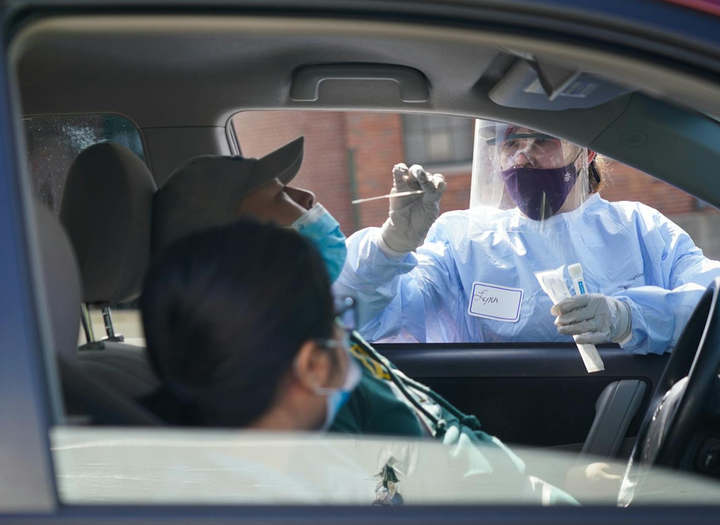 Lynn Eidahl with Hennepin Health administered tests at a free walk-up/drive-through COVID-19 testing event at the Abubakar As-Saddique Islamic Center in Minneapolis in September.