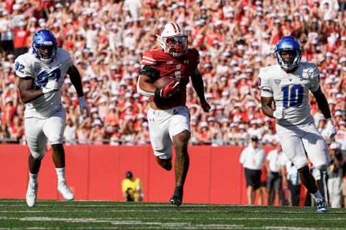 Wisconsin's Chez Mellusi ran for a touchdown during the second half against Buffalo on Saturday in Madison