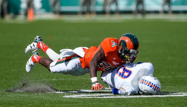 Colorado State's Kevin Pierre-Louis tackles Savannah State's Ker-Sean Wilson during an NCAA college football game, Saturday, Sept. 5, 2015, at Hughes 