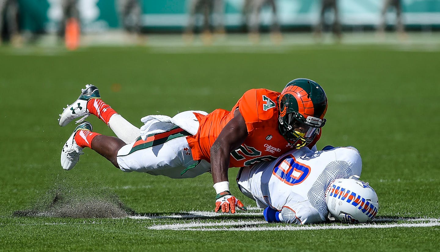 Colorado State's Kevin Pierre-Louis tackles Savannah State's Ker-Sean Wilson during an NCAA college football game, Saturday, Sept. 5, 2015, at Hughes Stadium in Fort Collins, Colo.