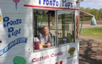 Kathy Heise starts making cotton candy at her Pronto Pup stand in Faribault, Minn., first thing every morning.