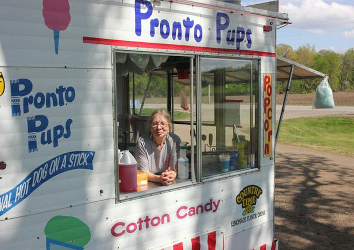 Kathy Heise starts making cotton candy at her Pronto Pup stand in Faribault, Minn., first thing every morning.