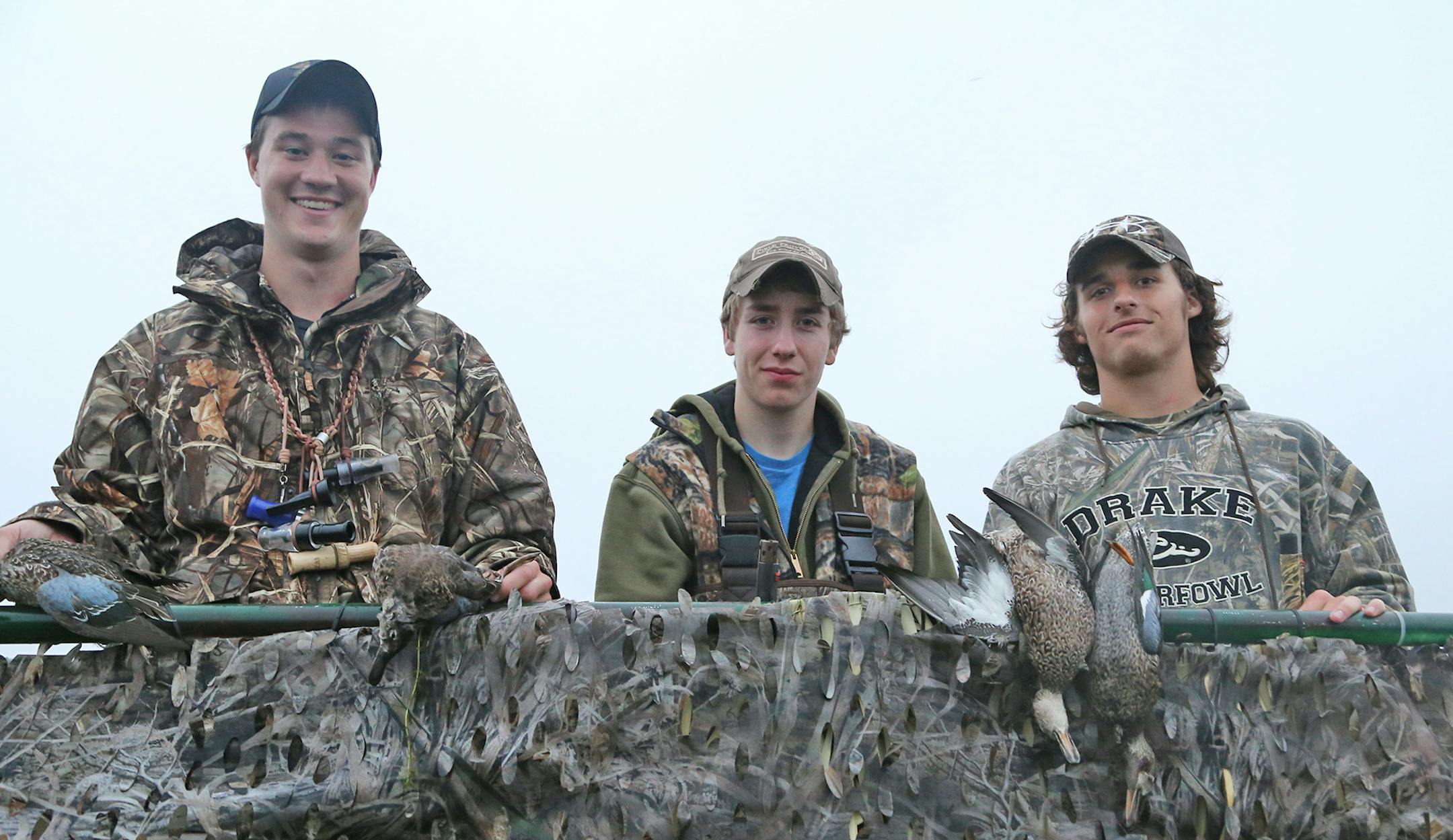 In the first half-hour or so of shooting Saturday morning, Trevor Unruh, left, Riley Mcalpine and Ryder Beckman had a handful of teal to their credit. They were hunting on Pelican Lake near St. Michael.