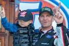 Clint Bowyer, right, and his 3-year-old son, Cash, celebrated after winning a NASCAR race at Martinsville Speedway in Martinsville, Va., on Monday.
