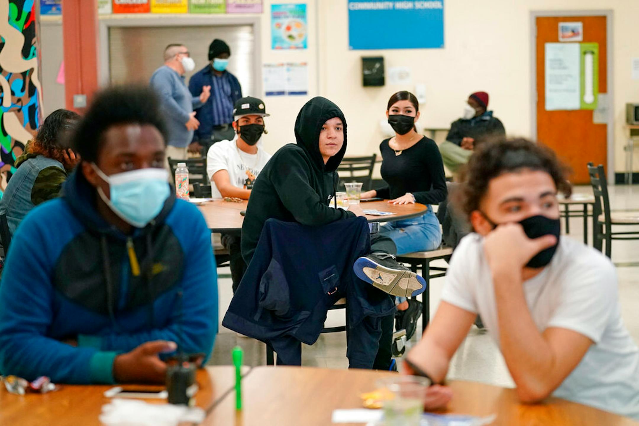 Students at West Brooklyn Community High School during a current events-trivia quiz and pizza party in the school's cafeteria in New York.