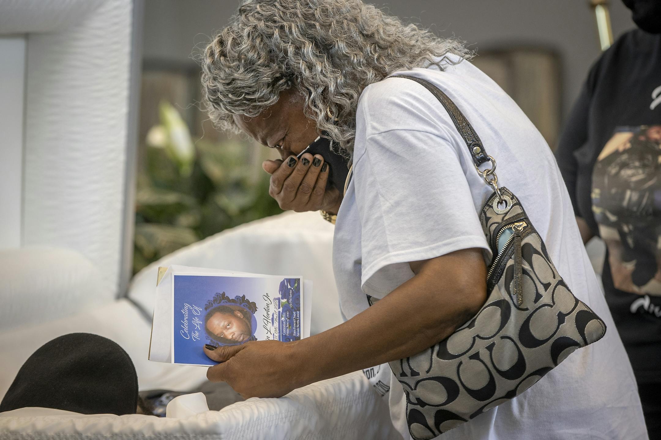Mae Roberts said her last farewell to her son Calvin L. Horton Jr. after his funeral at Estes Funeral Chapel, Friday, June 19, 2020 in Minneapolis, MN. Horton was shot and killed by John Richard Rieple, a pawn broker. Police found Horton lying on the sidewalk in front of the shop near Bloomington and Lake on the second night of civil unrest in the aftermath of the killing of George Floyd at the hands of Minneapolis police.