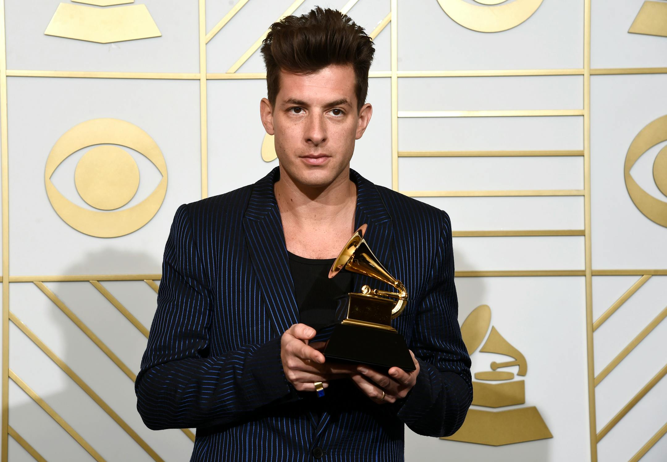 Mark Ronson poses in the press room with the award for best pop duo/group performance for �Uptown Funk� at the 58th annual Grammy Awards at the Staples Center on Monday, Feb. 15, 2016, in Los Angeles. (Photo by Chris Pizzello/Invision/AP)