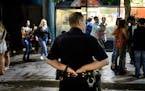 A Minneapolis Police officer looked for trouble along 5th Street near Hennepin Avenue after closing time early Sunday morning. ] AARON LAVINSKY &#xef;