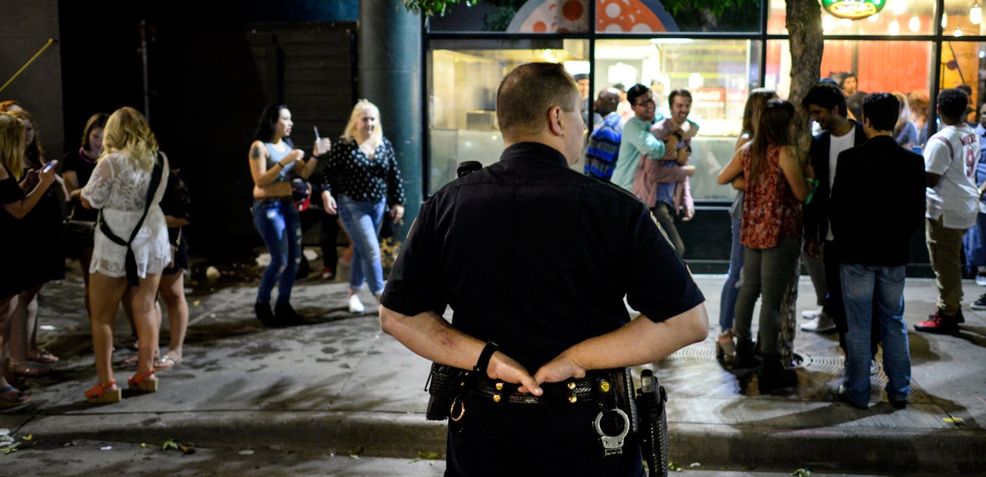 A Minneapolis Police officer looked for trouble along 5th Street near Hennepin Avenue after closing time early Sunday morning. ] AARON LAVINSKY &#xef; aaron.lavinsky@startribune.com The issue of downtown crime issue will likely spill into the mayoral race in Minneapolis. Will Betsy Hodges' downtown safety plan improve quality of life on Hennepin Avenue? Or can Tom Hoch, longtime theater district and downtown leader, make it into a campaign issue? Even if statistics show that downtown crime is mo