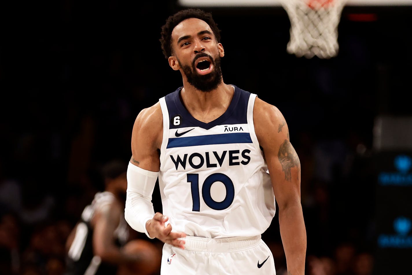 Minnesota Timberwolves guard Mike Conley reacts against the Brooklyn Nets during the second half of an NBA basketball game Tuesday, April 4, 2023, in New York. The Timberwolves won 107-102. (AP Photo/Adam Hunger)