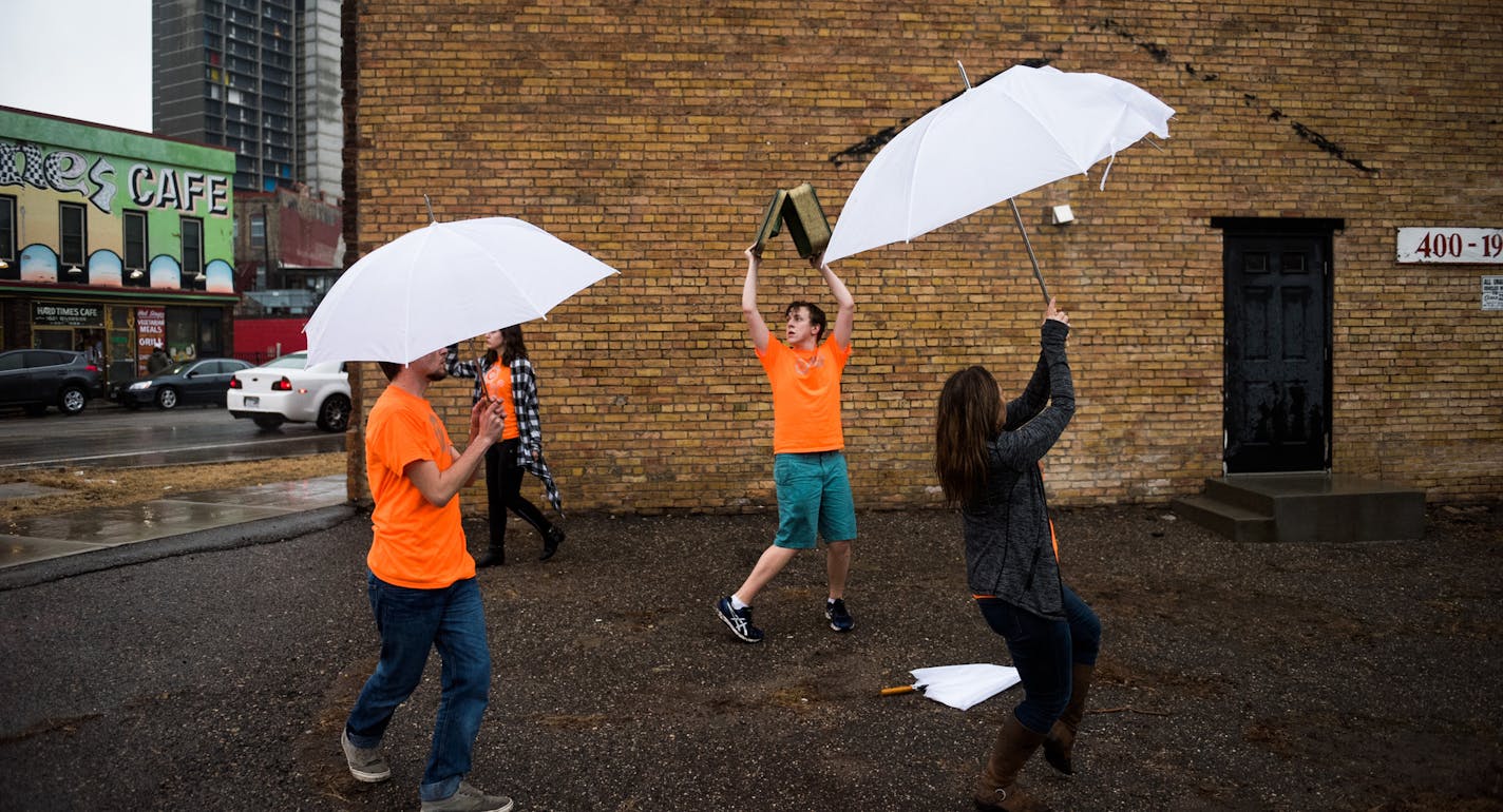 University of Minnesota students Seth Campbell (center), Parker Sturlaugson and Hayley Kopp perform a mime piece with instructor Kym Longhi (right). ] MARK VANCLEAVE &#xef; mark.vancleave@startribune.com * Artists performed a handful of public performance art pieces as part of THIS MACHINE (Not My President's Day), protesting recent actions by President Donald Trump across Minneapolis late Monday afternoon on Feb. 20, 2017.