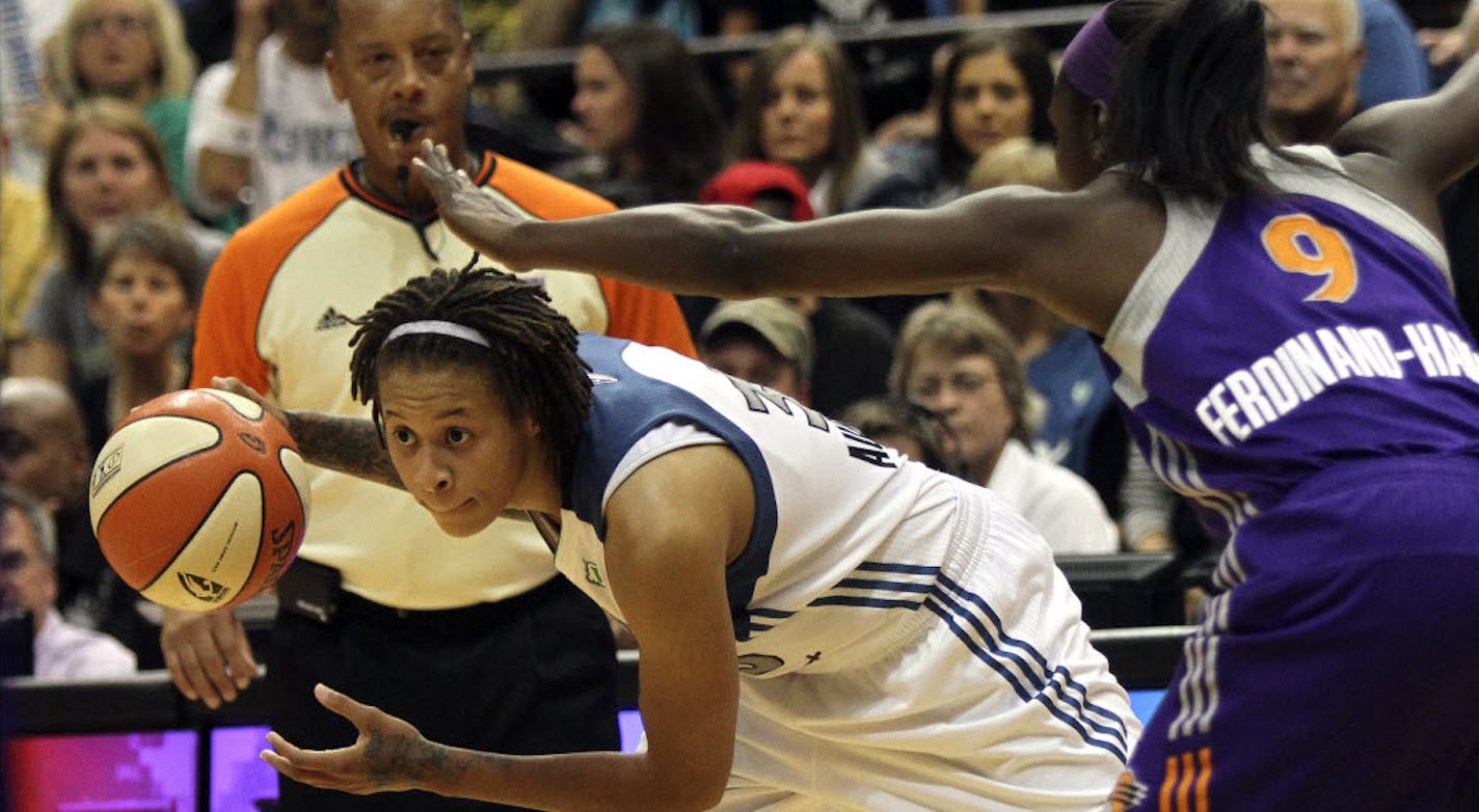 Seimone Augustus looked for a path to the basket against Mercury's Marie Ferdinand-Harris.