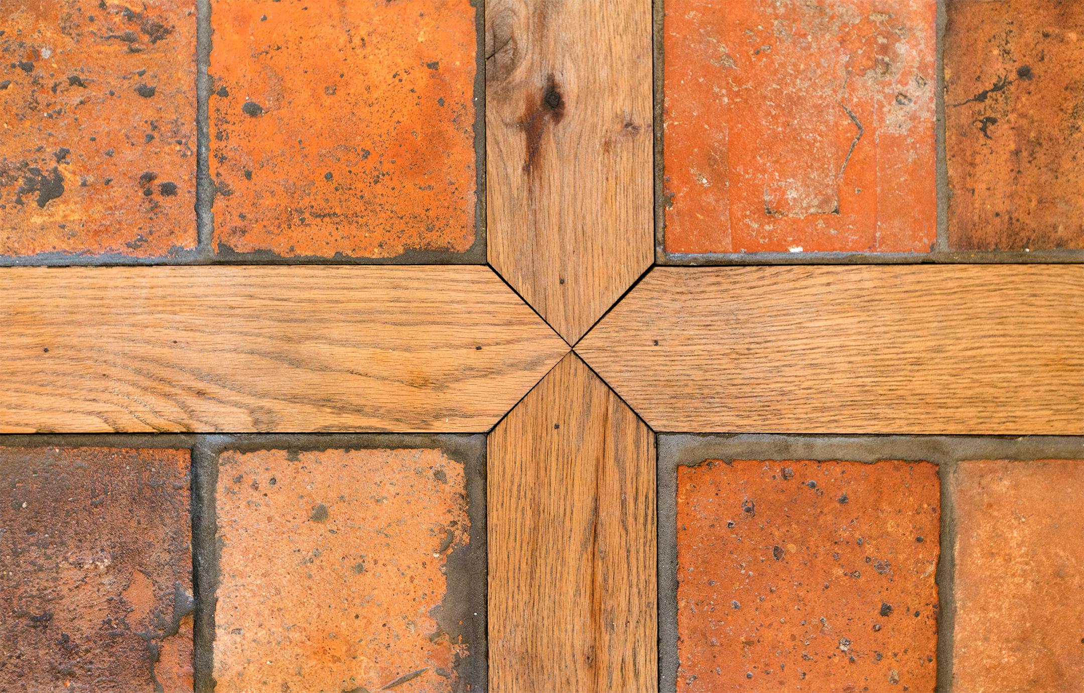 Recycled wood beams and tiles from France are used for flooring in the kitchen.