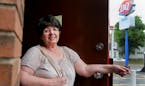 Carol Noyes, whose family had owned the Dairy Queen on Snelling Avenue for 65 years, stands in the doorway at DQ for perhaps the last time. Noyes, who