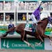 Victor Espinoza rides California Chrome to a victory during the 140th running of the Kentucky Derby horse race at Churchill Downs Saturday, May 3, 201