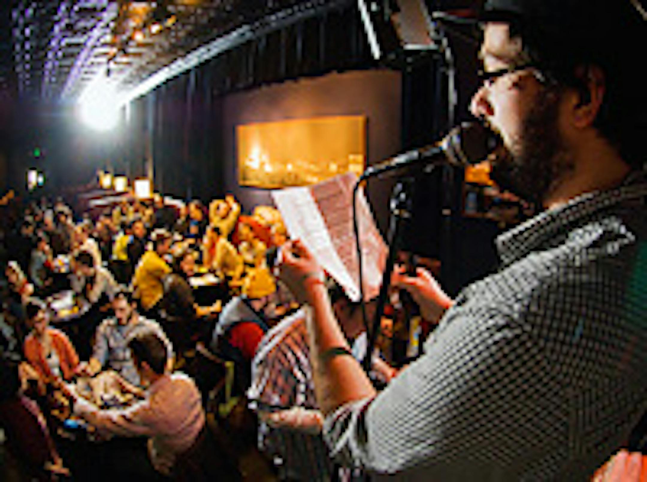 Host Chuck Terhark read a question to the 331 Club crowd at Chuck and Sean's Trivia on Sunday night.