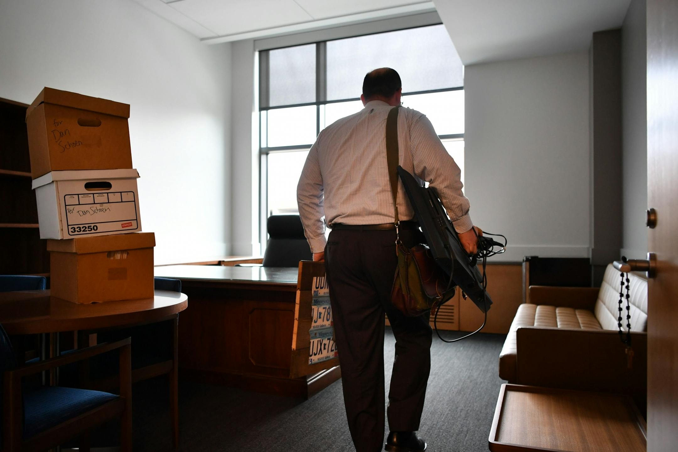DFL Senator Dan Schoen carried some of his things into his new office in the Senate Office Building. He is a former DFL State Representative.