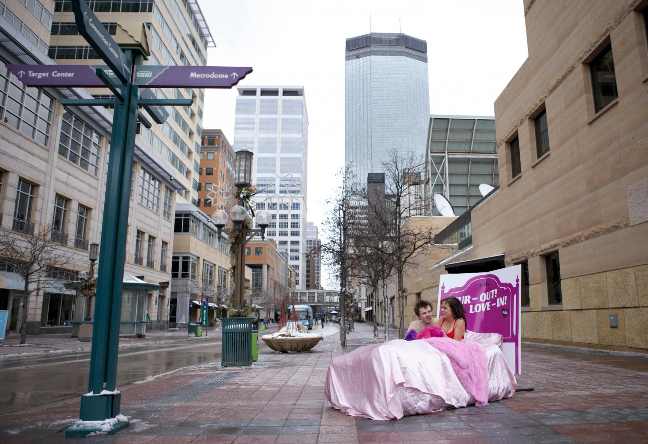 Jenna Cameron and Derek Ritchison snuggled up on a blow up mattress for an hour in below freezing temps to protest animal cruelty on 11th and Nicollet Mall in Downtown Minneapolis Monday.