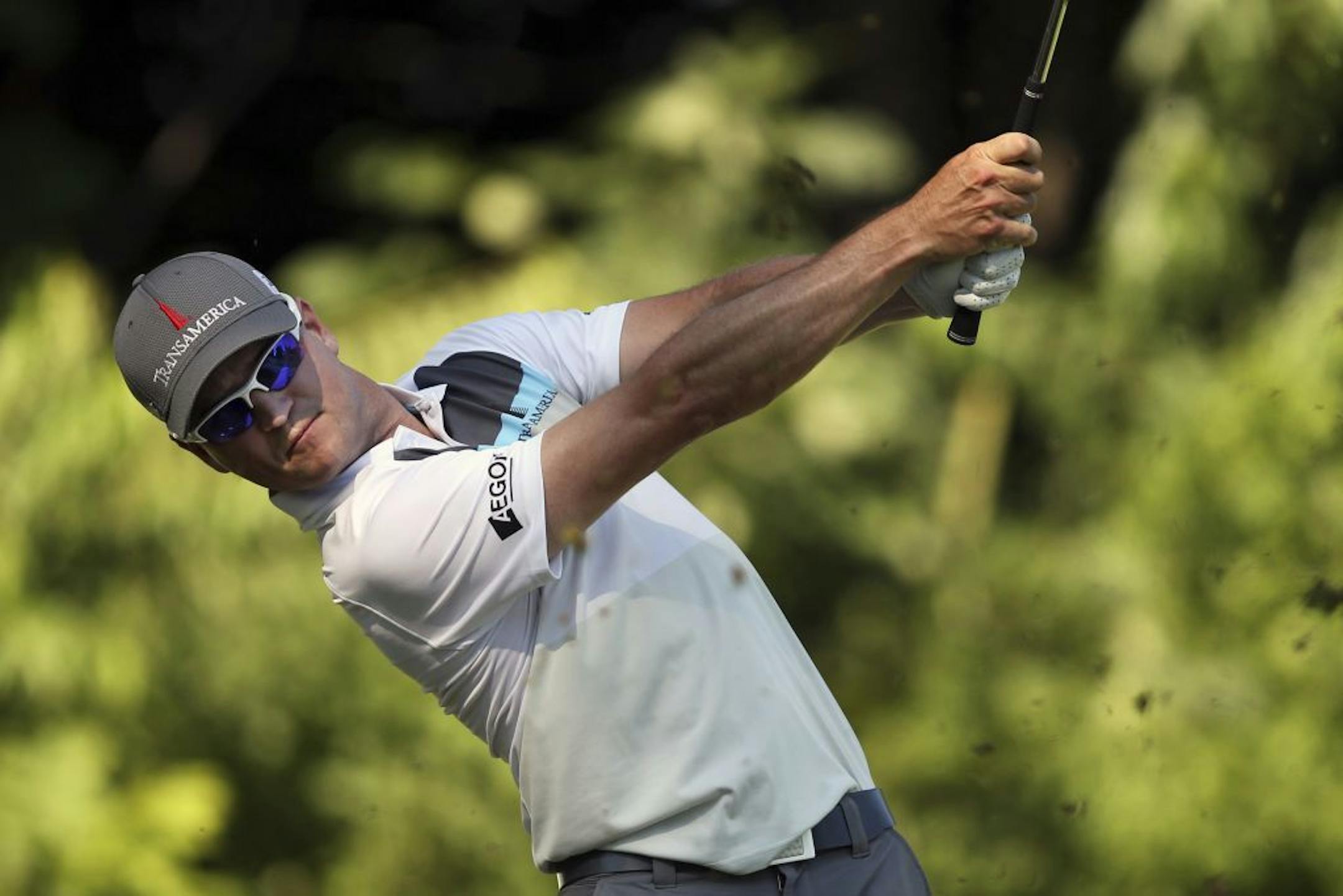 Zach Johnson tees off on the 16th hole of TPC Deere Run in Silvis, Ill., during the second round of the John Deere Classic
