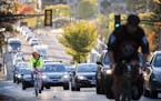 Cyclists and traffic move up Marshall Avenue eastbound in St. Paul during rush hour. ] LEILA NAVIDI &#x2022; leila.navidi@startribune.com BACKGROUND I
