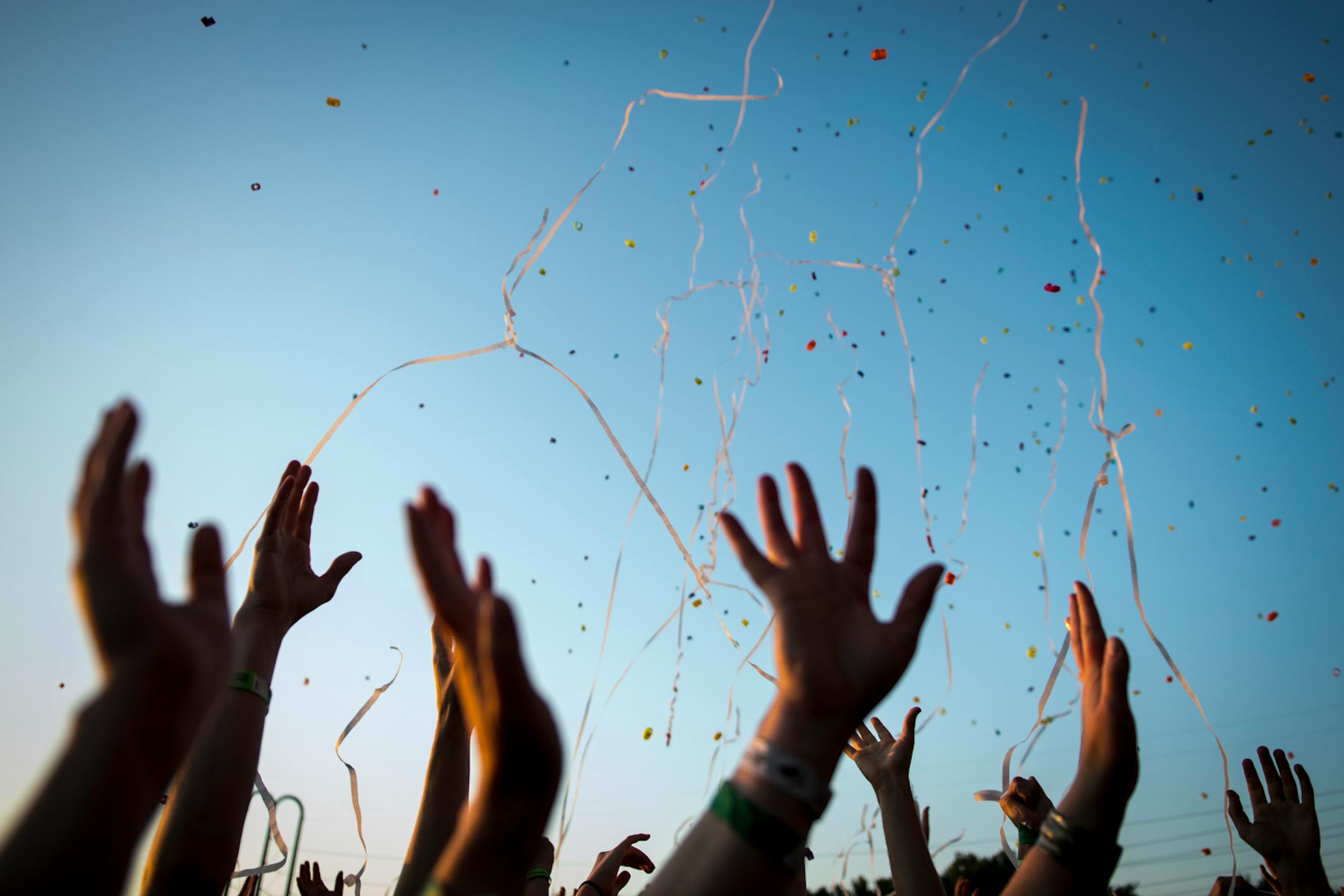 Festival goers reached into the air for confetti during the Flaming Lips' performance Saturday during Rock the Garden. ] (AARON LAVINSKY/STAR TRIBUNE) aaron.lavinsky@startribune.com