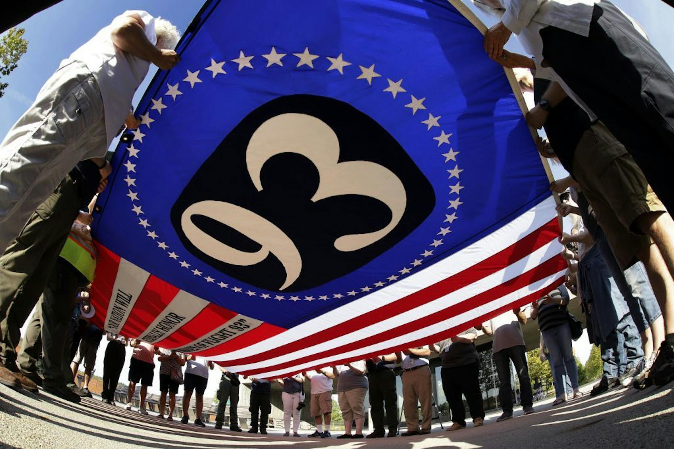 Visitors to the Flight 93 National Memorial in Shanksville, Pa., participate in a sunset memorial service on Tuesday, Sept. 10, 2019, as the nation prepares to mark the 18th anniversary of the Sept. 11, 2001 attacks.