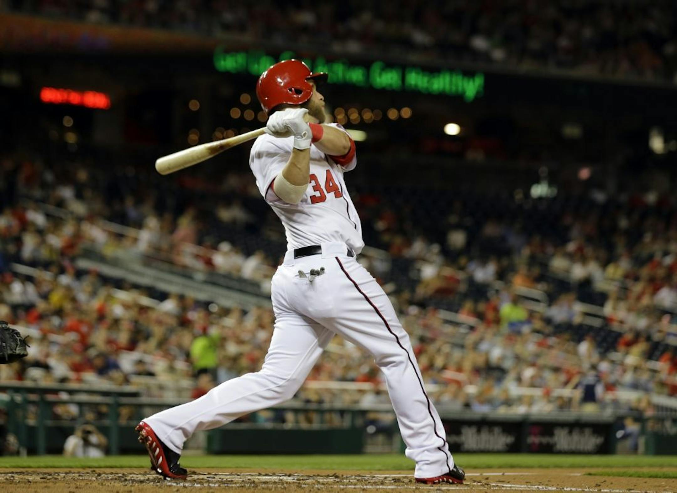 Nationals left fielder Bryce Harper watches his solo home run during the fourth inning against the Chicago White Sox