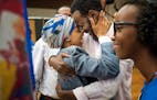 Rep. Ilhan Omar hugged her husband Ahmed Hirsi after she won the DFL endorsement. Their daughter Isra Hirsi, 15, is on the right.