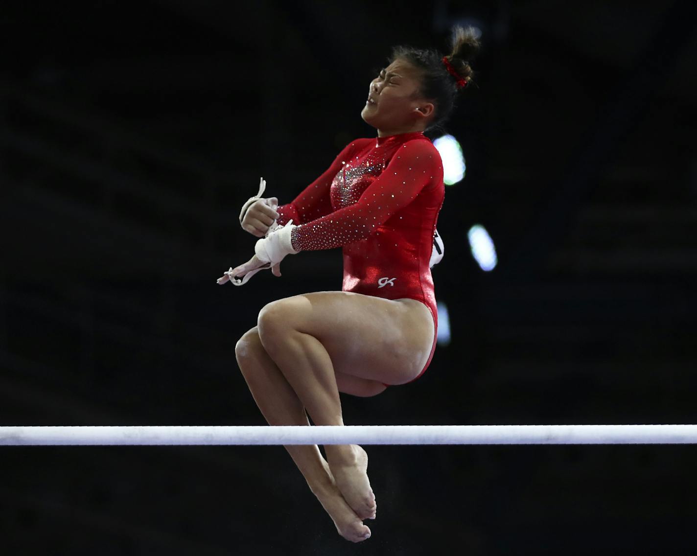 CORRECTS THAT SUNISA IS FROM THE UNITED STATES AND NOT CHINA AS ORIGINALLY SENT - Lee Sunisa of the United States performs on the uneven bars in the women's all-around final at the Gymnastics World Championships in Stuttgart, Germany, Thursday, Oct. 10, 2019. (AP Photo/Matthias Schrader)