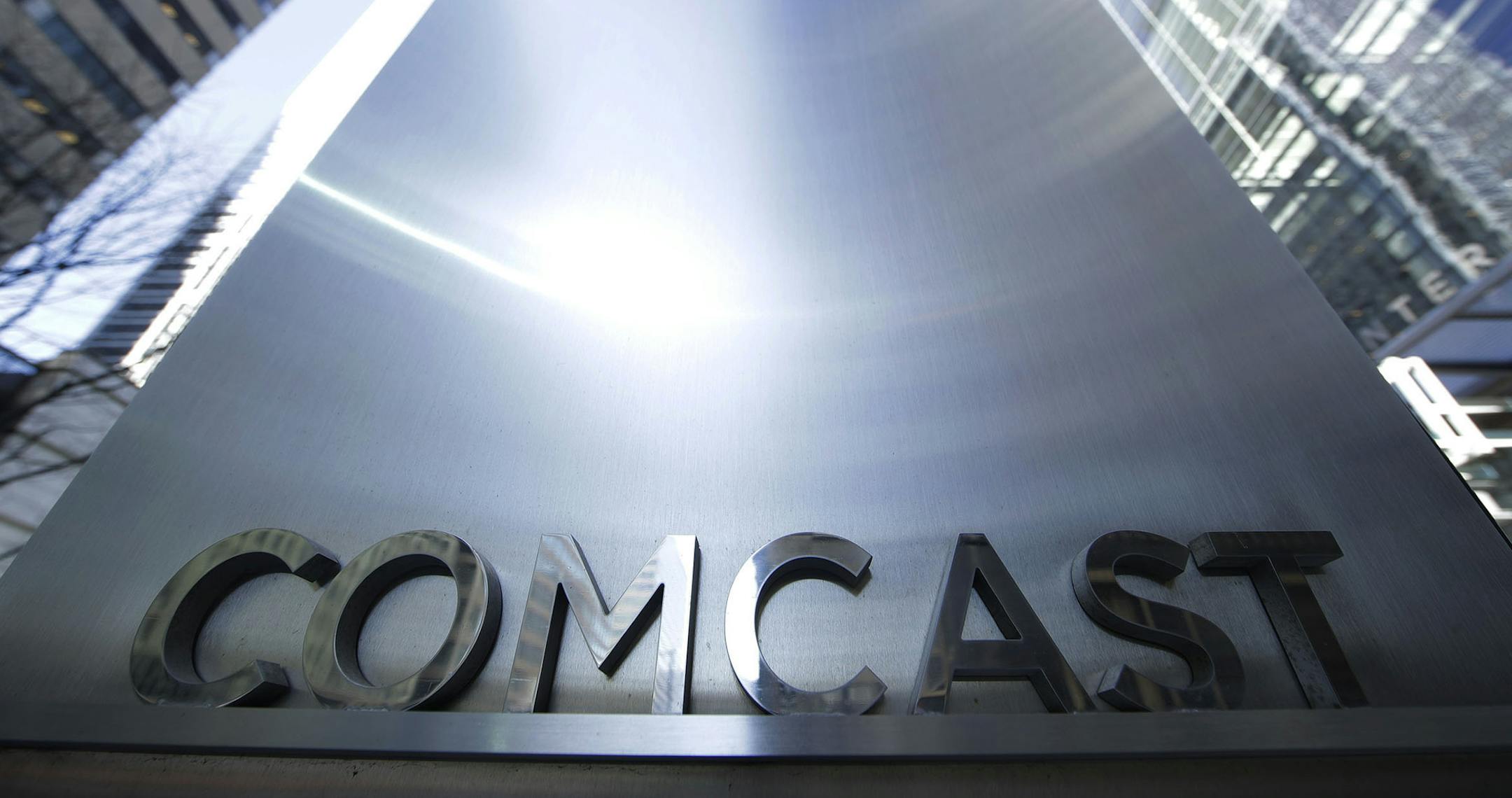 This Wednesday, March 29, 2017, photo shows a sign outside the Comcast Center in Philadelphia. Comcast Corp. reports financial results Thursday, Oct. 26, 2017. (AP Photo/Matt Rourke) ORG XMIT: MIN2017112918322348