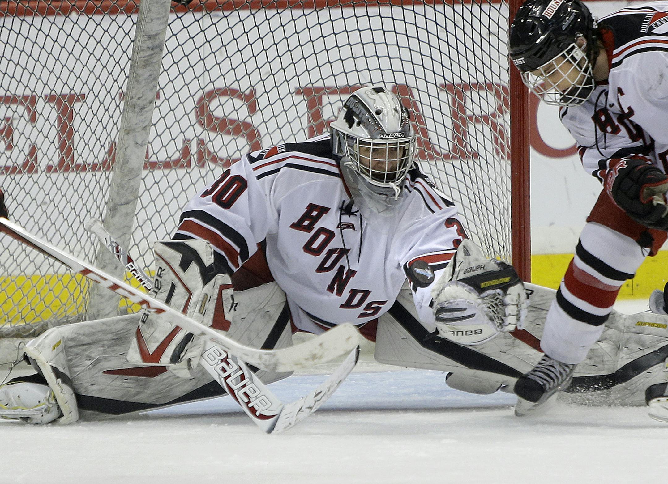 Duluth East's Dylan Parker made a save during third period during the Class 2A boys' hockey state tournament quarterfinals at the Xcel Energy Center, Thursday, March 7, 2013 in St. Paul, MN.(ELIZABETH FLORES/STAR TRIBUNE) ELIZABETH FLORES • eflores@startribune.com