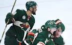 From left, Wild left wing Jordan Greenway (18), defenseman Ryan Suter (20) and center Eric Staal (12) celebrated a goal by Staal in the third period