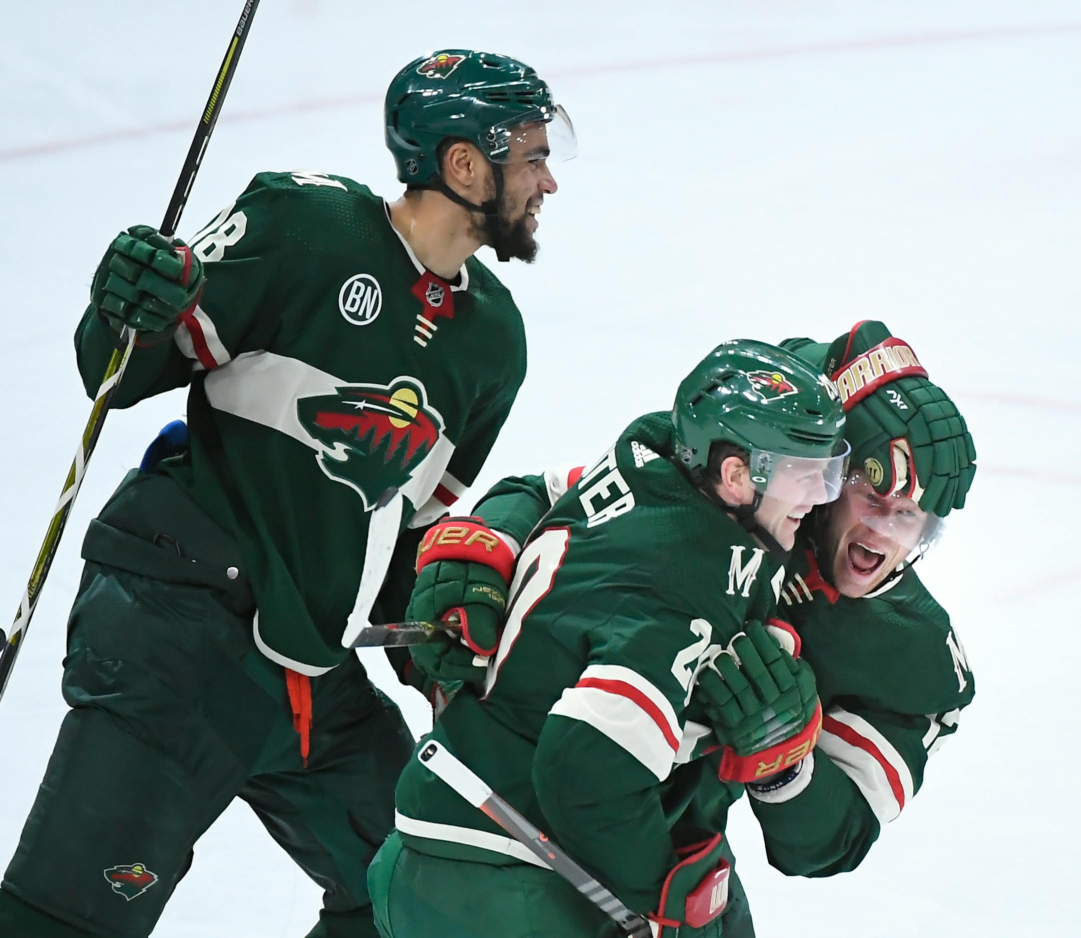 From left, Wild left wing Jordan Greenway (18), defenseman Ryan Suter (20) and center Eric Staal (12) celebrated a goal by Staal in the third period