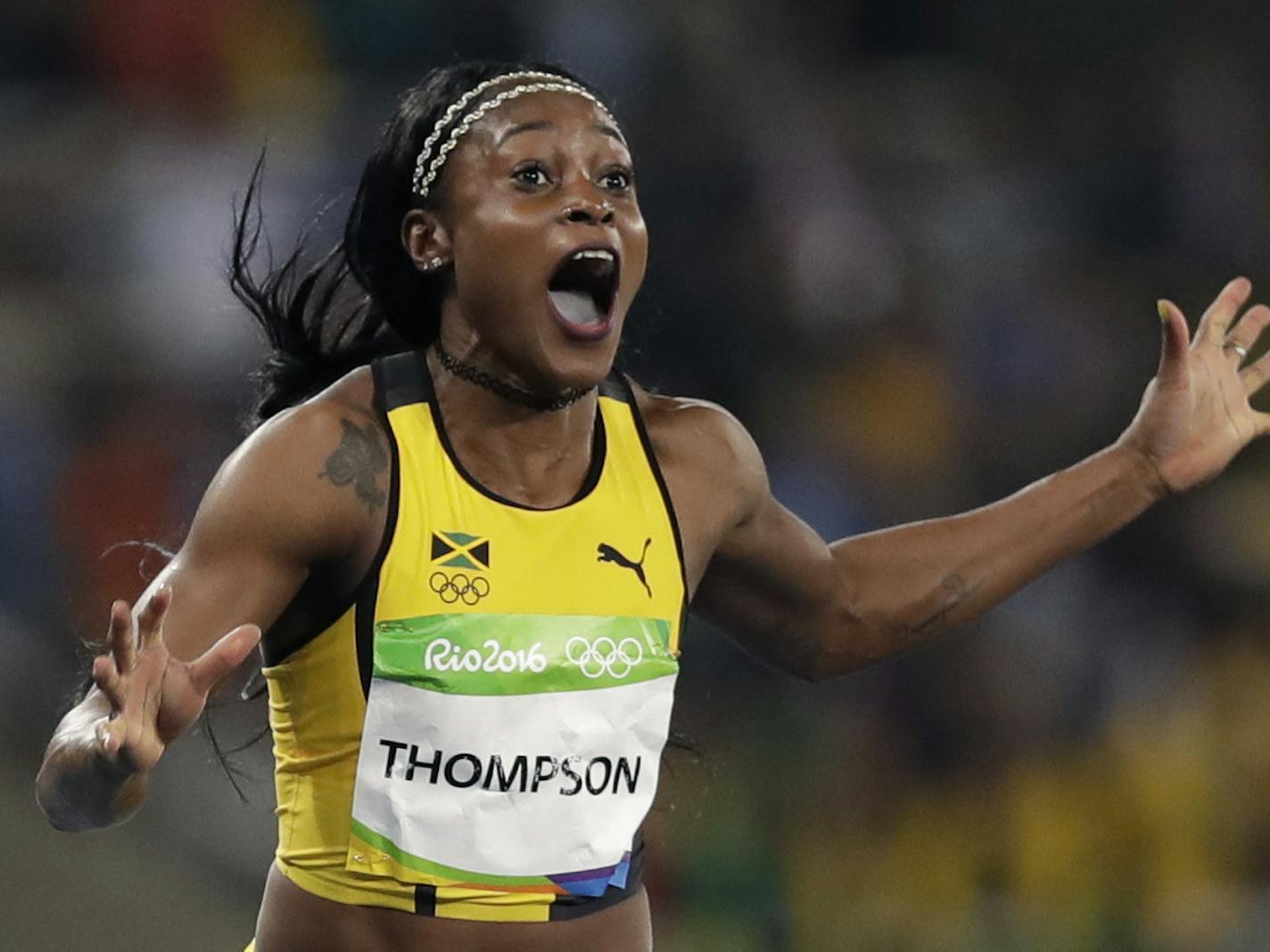 Jamaica's Elaine Thompson wins the gold medal in the women's 100-meter final during the athletics competitions of the 2016 Summer Olympics at the Olympic stadium in Rio de Janeiro, Brazil, Saturday, Aug. 13, 2016. (AP Photo/David J. Phillip)