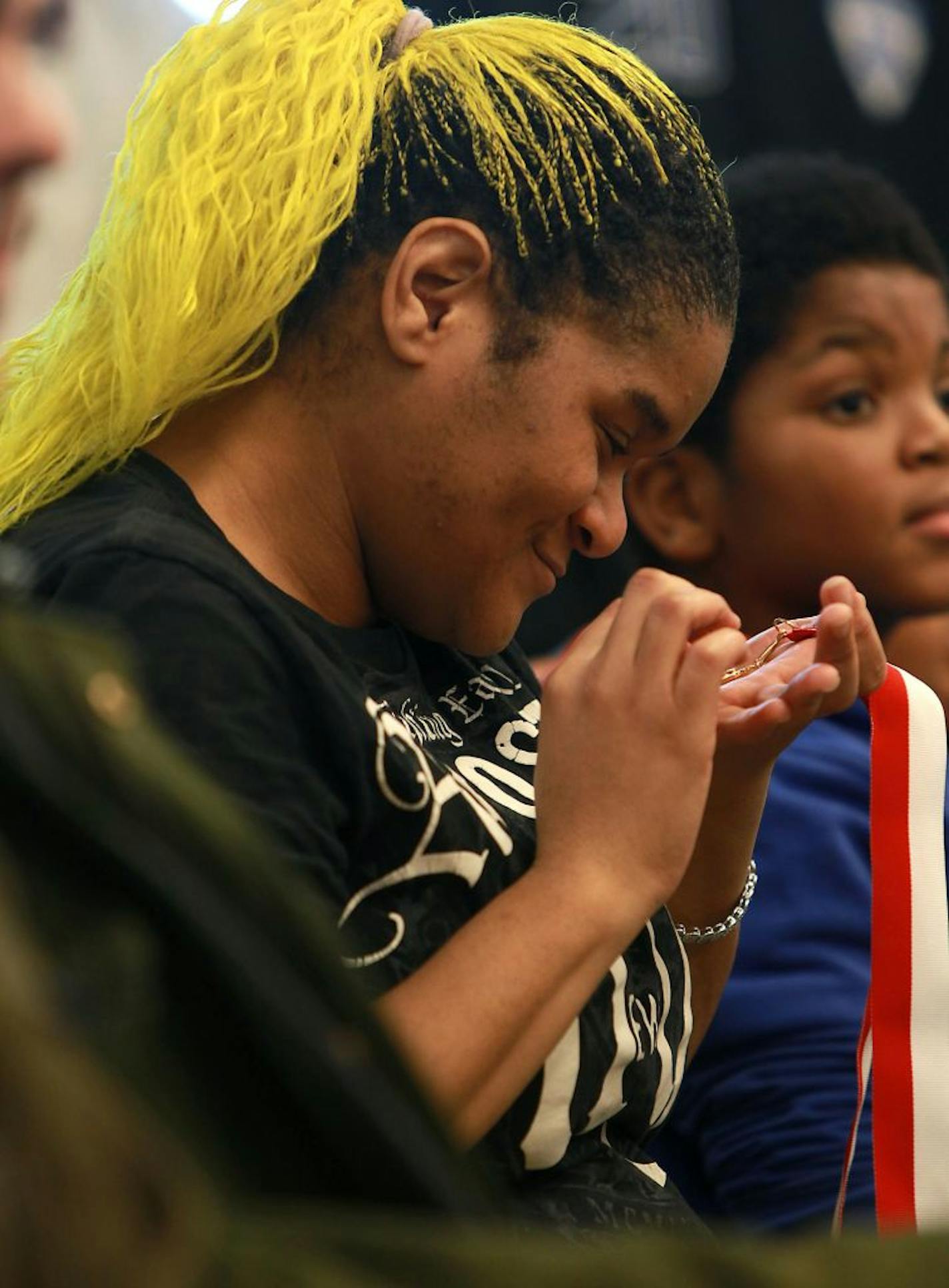 Ebony Jones savored the award that her son Jayvion received from the St. Paul Police Department for his efforts to save her from an abusive boyfriend.