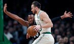 Celtics forward Gordon Hayward, right, tries to drive past Timberwolves guard Josh Okogie during the first quarter Wednesday.
