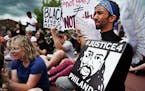 Protesters gathered at Silver Lake Village Shopping Center. Abdi Iman, of Eden Prairie dressed as an angel and said,&#x201d;Philando is looking down a