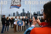 From left Michigan State students Andrew Turnbull, Joey Kardynal, Sean Lammy, Kyle Turnbull get their picture taken in front of the Final Four logo be