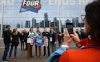 From left Michigan State students Andrew Turnbull, Joey Kardynal, Sean Lammy, Kyle Turnbull get their picture taken in front of the Final Four logo be