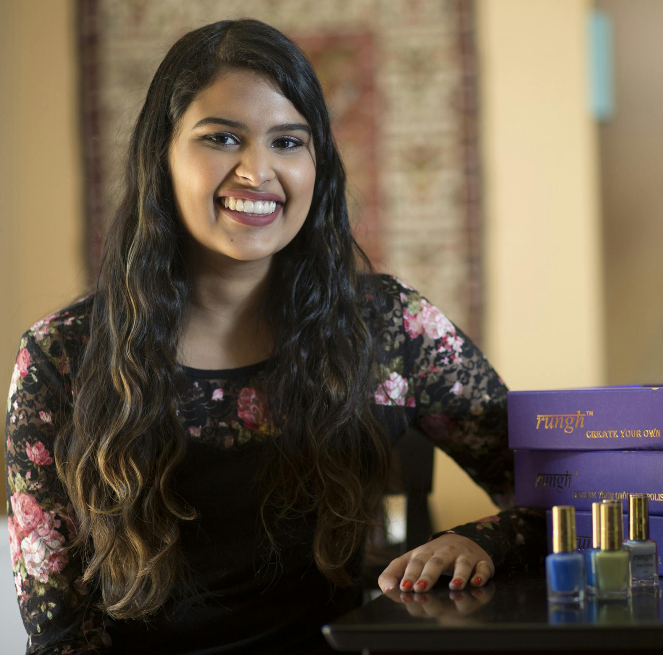 Neha Raman sits in her kitchen, where she has developed her nail polish brand, Rungh, Saturday, July 8, 2017. Raman has been developing her nail polish line with the help of her parents since she attended high school at North Penn. (Margo Reed/Philadelphia Inquirer/TNS)