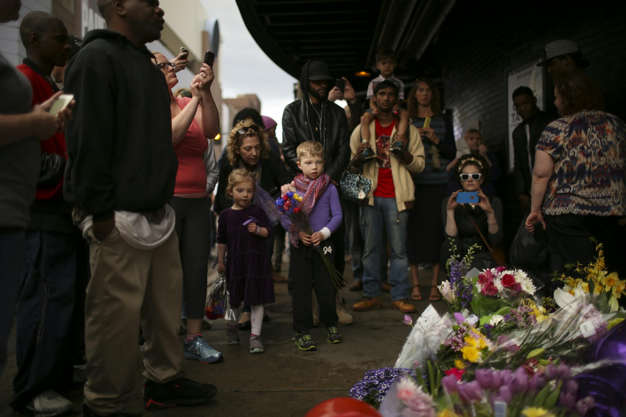 The growing memorial under Prince's star at First Ave. drew multitudes of fans throughout Tuesday afternoon and evening.