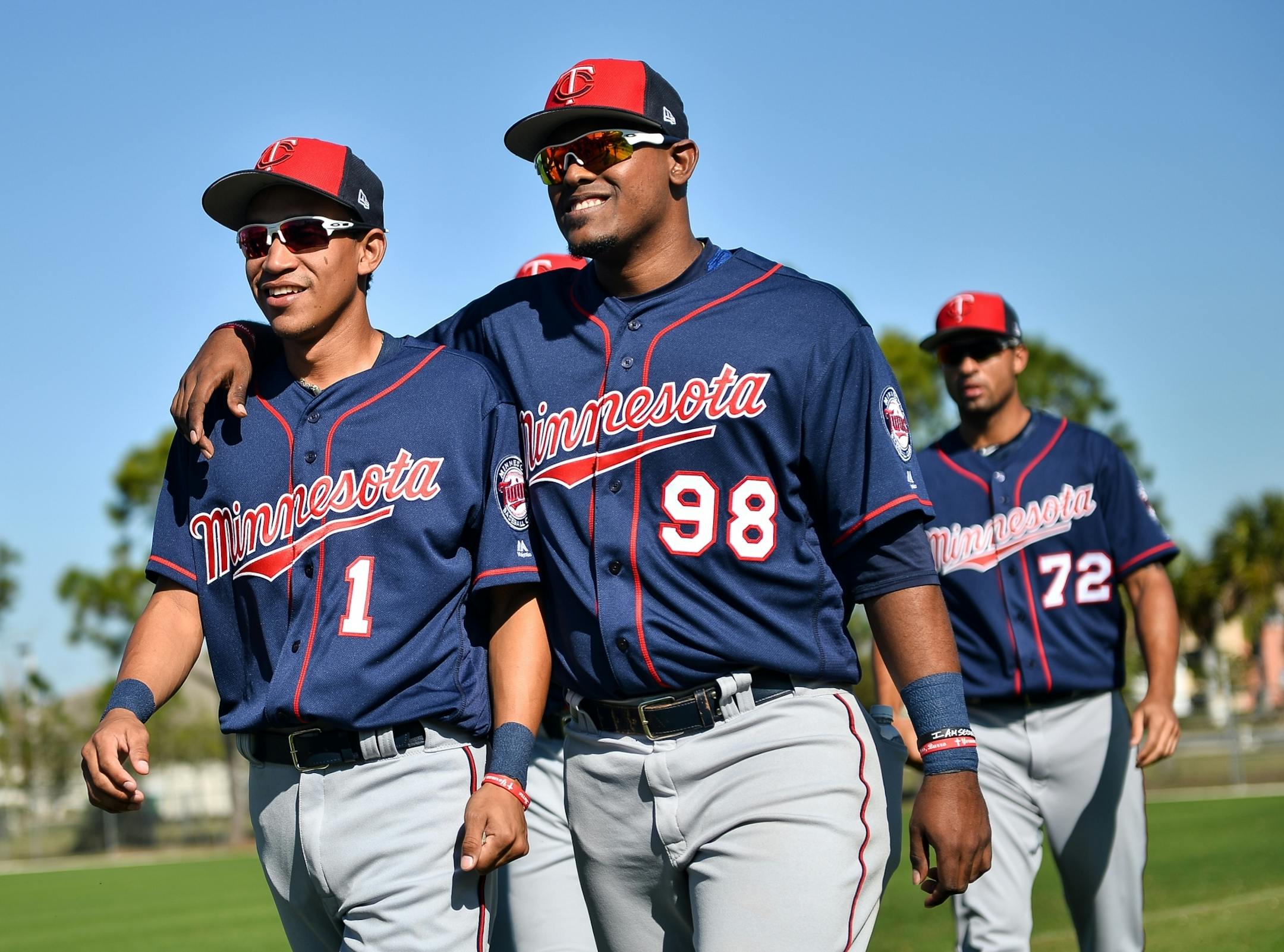 Fort Myers Miracle catcher Brian Navarreto (98) put his arm around Twins shortstop Engelb Vielma (1) as they walked to get their gloves during warmups Sunday.
