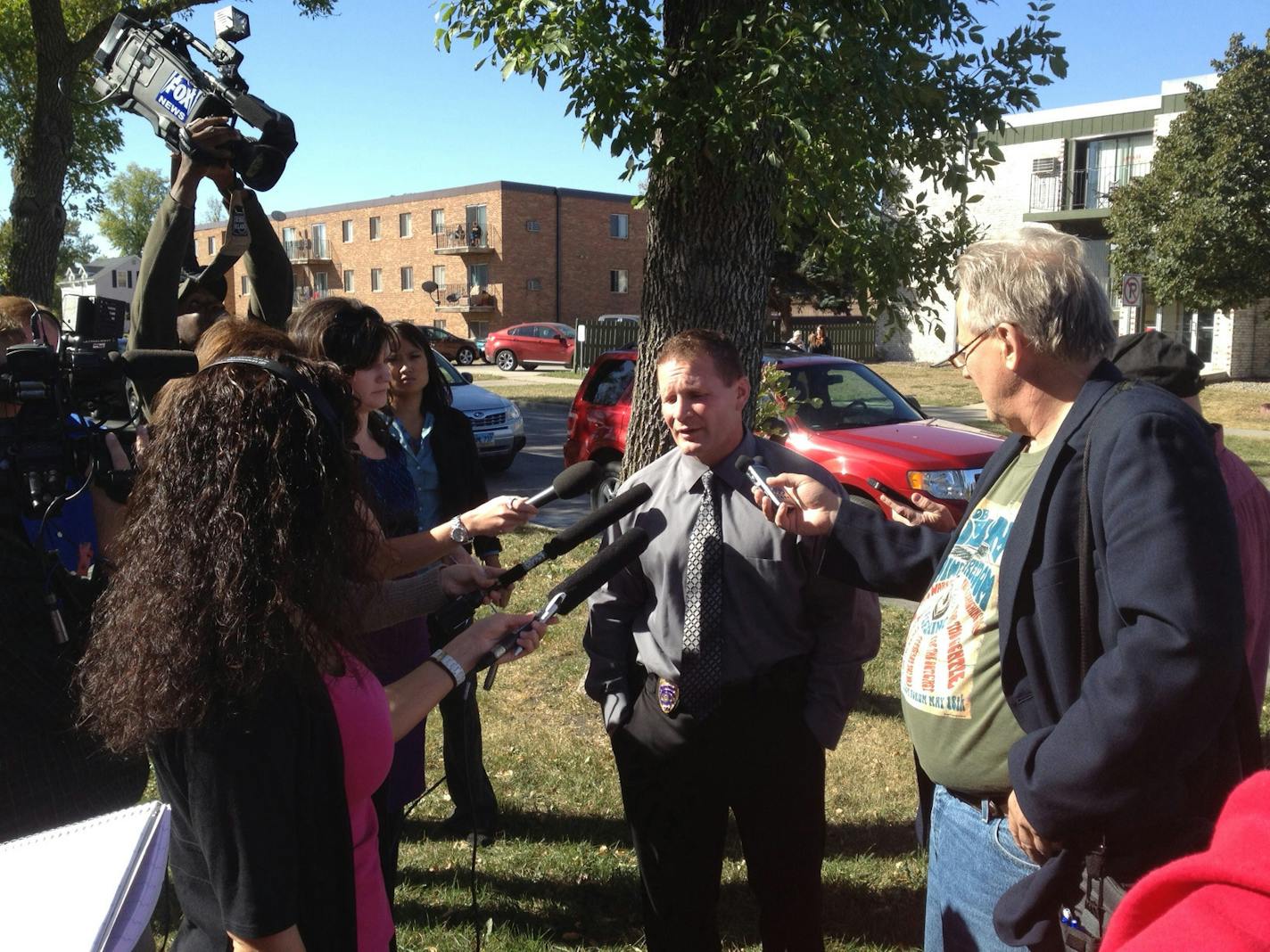 Lt. Joel Vettel of the Fargo Police Department talks to the media near the North Dakota State University campus in Fargo, N.D., following a bomb threat that forced the evacuation of the campus on Friday, Sept. 14, 2012. Thousands of people streamed off university campuses in Texas and North Dakota on Friday after phoned-in bomb threats prompted evacuations and officials warned students and faculty to get away as quickly as possible. No bombs had been found on either campus by midmorning and it w