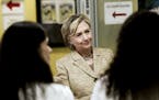 Hillary Clinton, the Democratic presidential nominee, greets members of the staff as she tours the Borinquen Health Care Center in Miami, Aug. 9, 2016