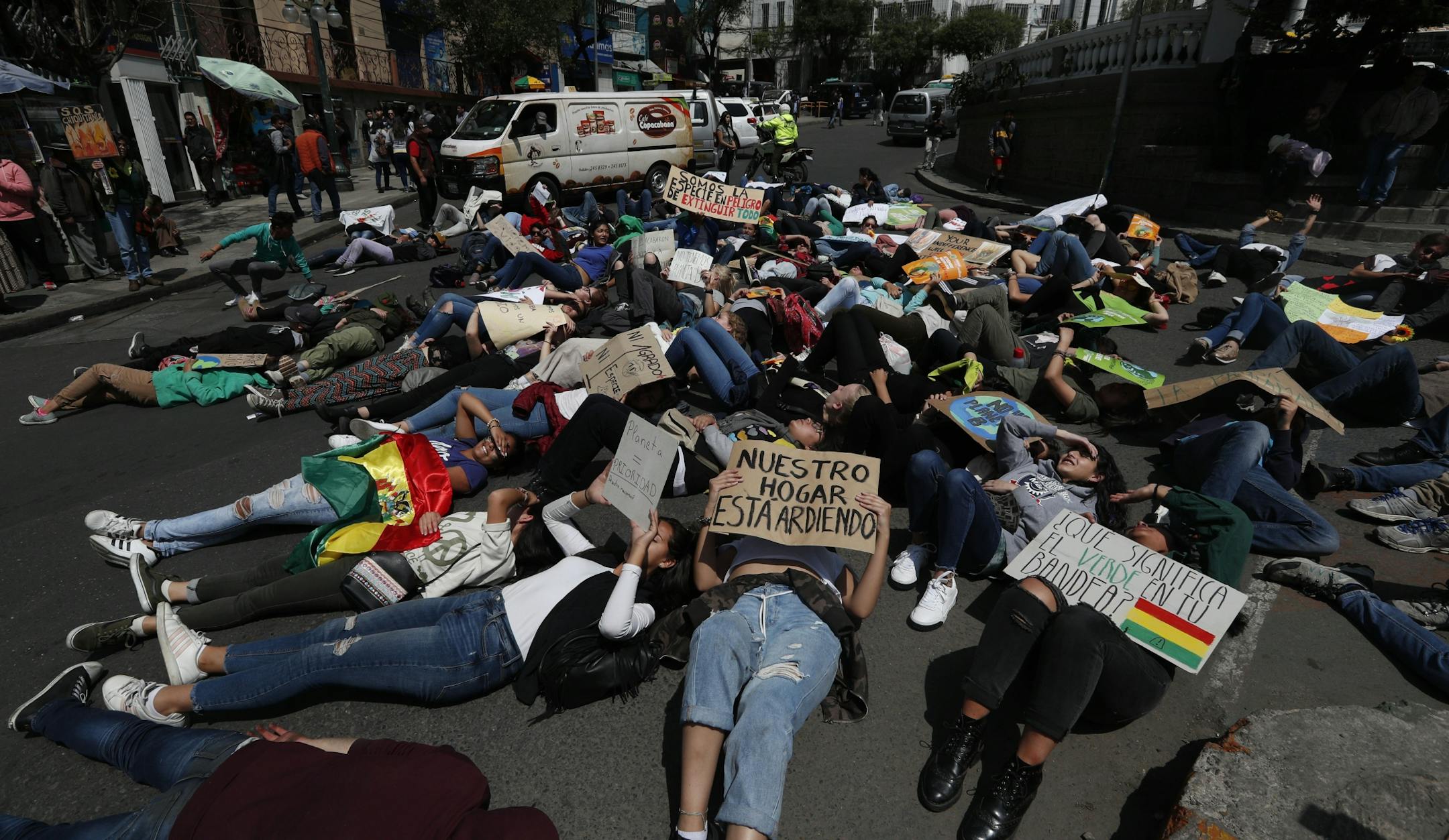 Youth take part in a global protest on climate change in La Paz, Bolivia, Friday, Sept. 20, 2019. Across the globe, hundreds of thousands of people took to the streets Friday to demand that leaders tackle climate change in the run-up to a U.N. summit.